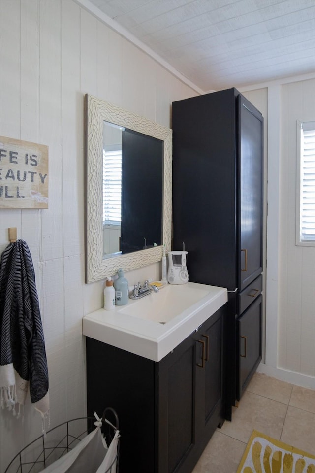 16535 Jamaica Inn Rd, Jamaica Beach, TX 77554 - bathroom featuring tile patterned floors, vanity, healthy amount of natural light, and ornamental molding