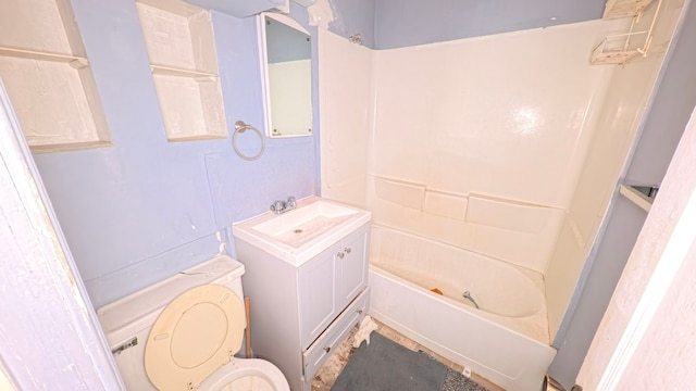 bathroom featuring toilet, vanity, and tub / shower combination