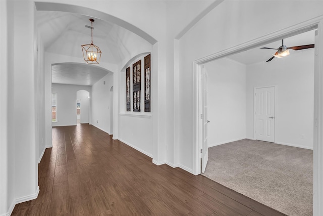 3031 Clover Trace Dr, Spring, TX 77386 - foyer entrance featuring arched walkways, dark wood-style floors, a chandelier, and baseboards