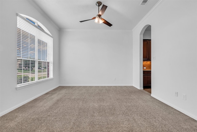 3031 Clover Trace Dr, Spring, TX 77386 - unfurnished room with ornamental molding, carpet flooring, a ceiling fan, arched walkways, and baseboards