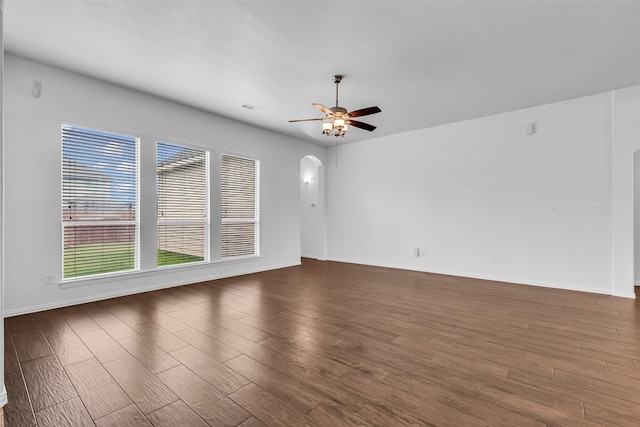 3031 Clover Trace Dr, Spring, TX 77386 - spare room featuring ceiling fan, wood finished floors, arched walkways, and baseboards