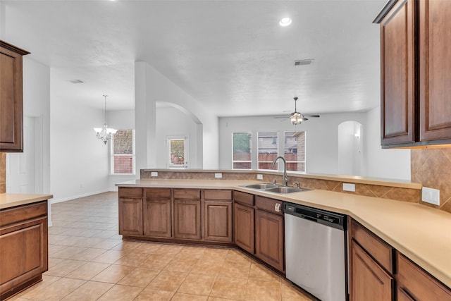 3031 Clover Trace Dr, Spring, TX 77386 - kitchen with dishwasher, a sink, plenty of natural light, arched walkways, and recessed lighting