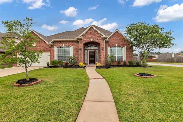 3031 Clover Trace Dr, Spring, TX 77386 - traditional-style house featuring brick siding, concrete driveway, a shingled roof, and a garage