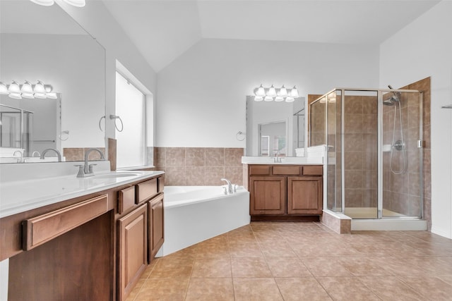 3031 Clover Trace Dr, Spring, TX 77386 - full bath featuring tile patterned flooring, a shower stall, a bath, two vanities, and lofted ceiling