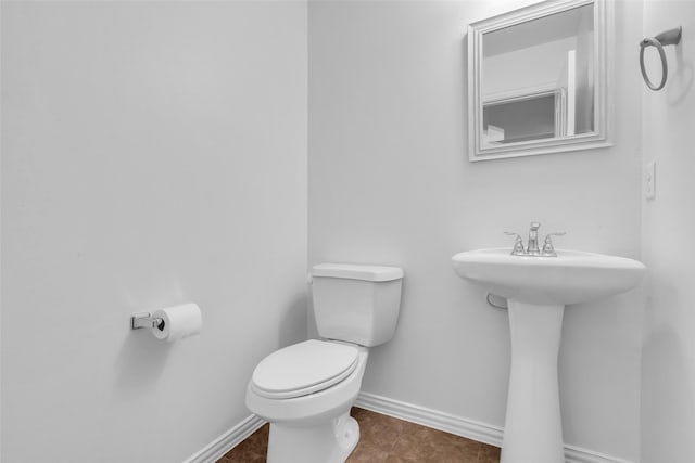 3031 Clover Trace Dr, Spring, TX 77386 - half bathroom featuring baseboards, toilet, and tile patterned floors