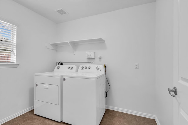 3031 Clover Trace Dr, Spring, TX 77386 - washroom with washer and dryer, baseboards, and tile patterned floors