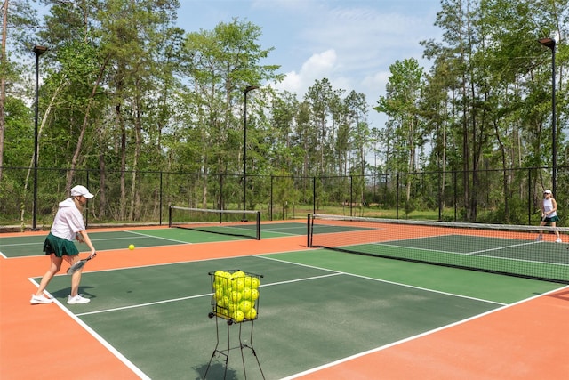 16163 Rustling Woods Rd, Conroe, TX 77302 - view of tennis court with community basketball court
