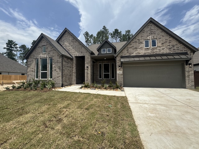 16163 Rustling Woods Rd, Conroe, TX 77302 - view of front of property with brick siding and driveway