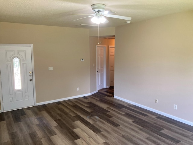 10479 Royal Tricia Dr, Conroe, TX 77303 - foyer entrance with a ceiling fan, dark wood finished floors, and baseboards