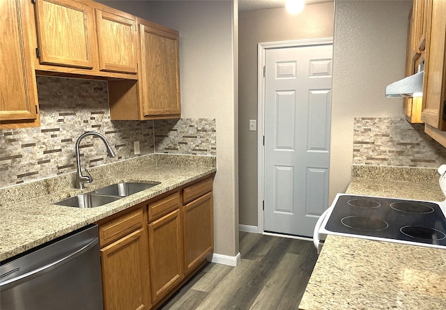 10479 Royal Tricia Dr, Conroe, TX 77303 - kitchen featuring dishwasher, a sink, backsplash, dark wood finished floors, and extractor fan