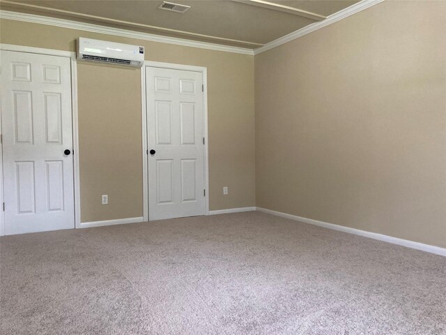 10479 Royal Tricia Dr, Conroe, TX 77303 - unfurnished bedroom with a wall mounted air conditioner, crown molding, carpet, baseboards, and a closet