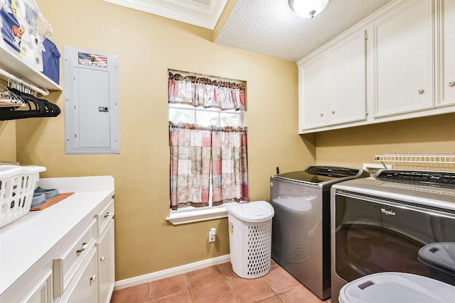 57 Atascosita Trl, Dayton, TX 77535 - laundry room with electric panel, cabinet space, washing machine and dryer, light tile patterned floors, and baseboards