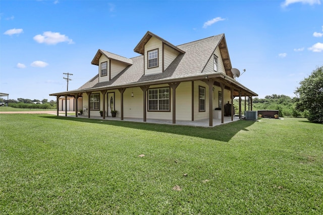 999 Salem Rd, Brenham, TX 77833 - view of side of home with a hot tub, cooling unit, a patio area, and a lawn