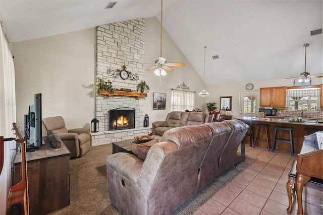 999 Salem Rd, Brenham, TX 77833 - living area featuring ceiling fan, high vaulted ceiling, a fireplace, and light tile patterned floors