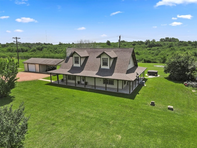 999 Salem Rd, Brenham, TX 77833 - rear view of property with dirt driveway, a lawn, a chimney, and a porch