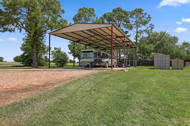 999 Salem Rd, Brenham, TX 77833 - view of vehicle parking featuring mail area, driveway, and a carport