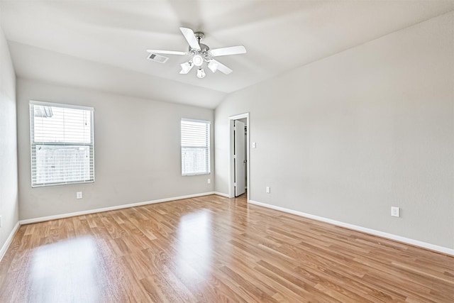 5212 Mcgrath Dr, Alvin, TX 77511 - spare room featuring light wood-type flooring, a ceiling fan, baseboards, and lofted ceiling