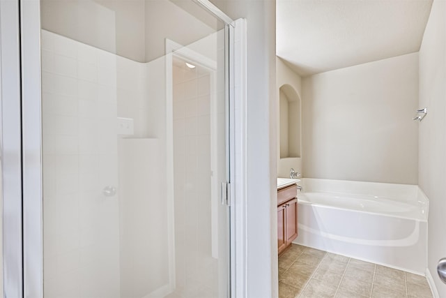 5212 Mcgrath Dr, Alvin, TX 77511 - full bathroom featuring a shower stall, vanity, a garden tub, and tile patterned flooring