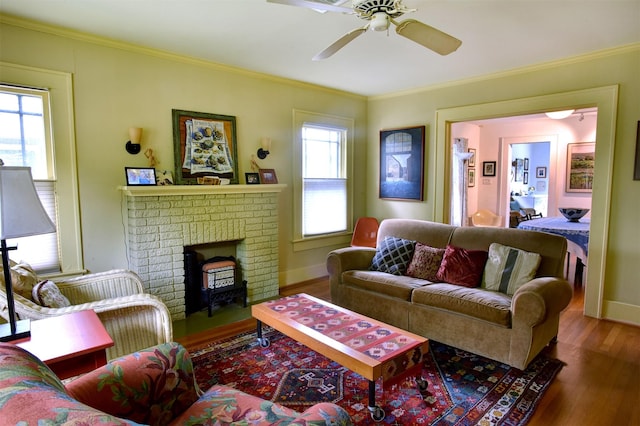 1119 E 7th 1/2 St, Houston, TX 77009 - living room with wood finished floors, ceiling fan, crown molding, a fireplace, and baseboards