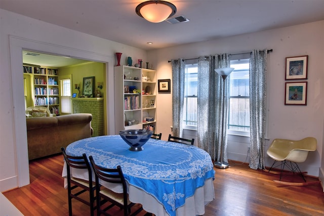 1119 E 7th 1/2 St, Houston, TX 77009 - dining area with wood finished floors and baseboards