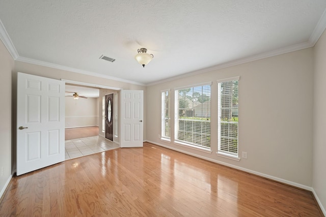 8602 Canyon Pine Dr, Spring, TX 77379 - unfurnished bedroom with wood finished floors, baseboards, and crown molding