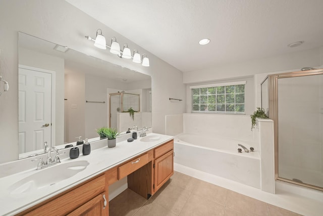 8602 Canyon Pine Dr, Spring, TX 77379 - full bath with a garden tub, double vanity, tile patterned flooring, a shower stall, and recessed lighting