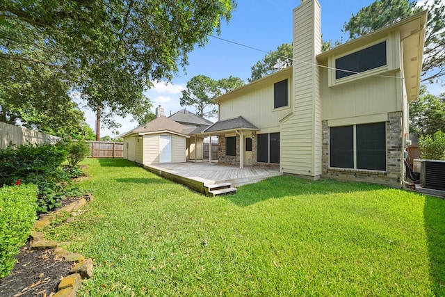 8602 Canyon Pine Dr, Spring, TX 77379 - rear view of property with a chimney, a deck, and central AC unit
