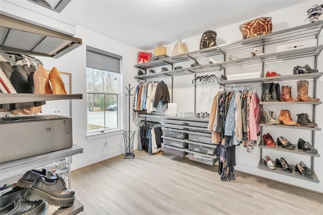 312 Tallow Dr, Conroe, TX 77385 - walk in closet featuring wood finished floors