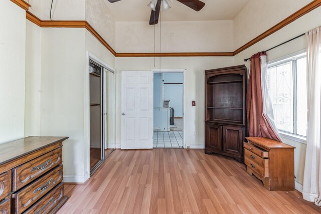2009 Chestnut St, Houston, TX 77009 - unfurnished bedroom featuring light wood-style flooring, baseboards, and a high ceiling