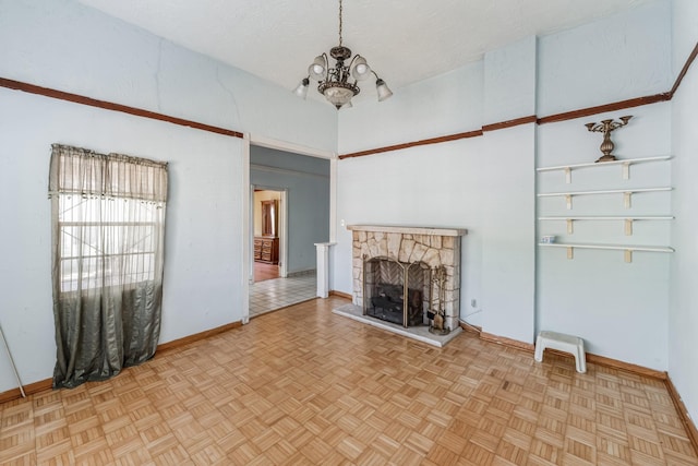 2009 Chestnut St, Houston, TX 77009 - unfurnished living room featuring a chandelier, a stone fireplace, and baseboards