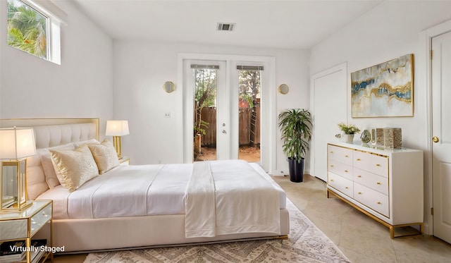 2436 Bissonnet St Unit 8, Houston, TX 77005 - bedroom featuring access to outside, multiple windows, and french doors