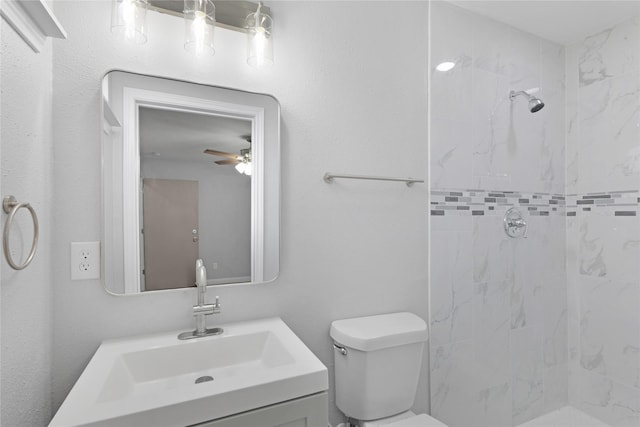 9827 Shive Dr, Houston, TX 77078 - full bath with tiled shower, toilet, vanity, and a ceiling fan