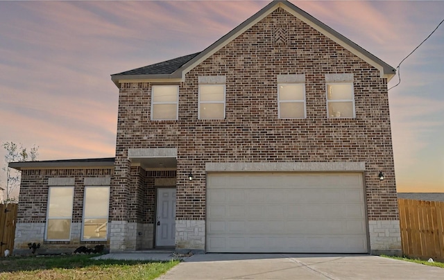 1189 County Road 5100, Cleveland, TX 77327 - view of front of property featuring brick siding, concrete driveway, and an attached garage