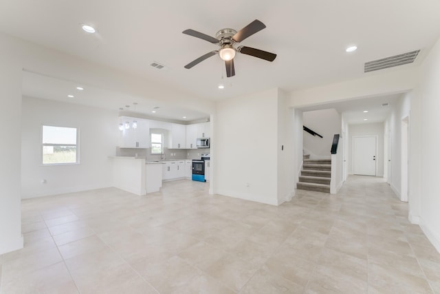 1189 County Road 5100, Cleveland, TX 77327 - unfurnished living room featuring stairs, ceiling fan, recessed lighting, light tile patterned floors, and baseboards