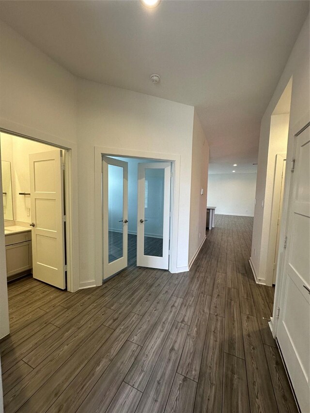 14007 Valley Creek Ct, Conroe, TX 77384 - hall featuring dark wood-style flooring, french doors, and baseboards