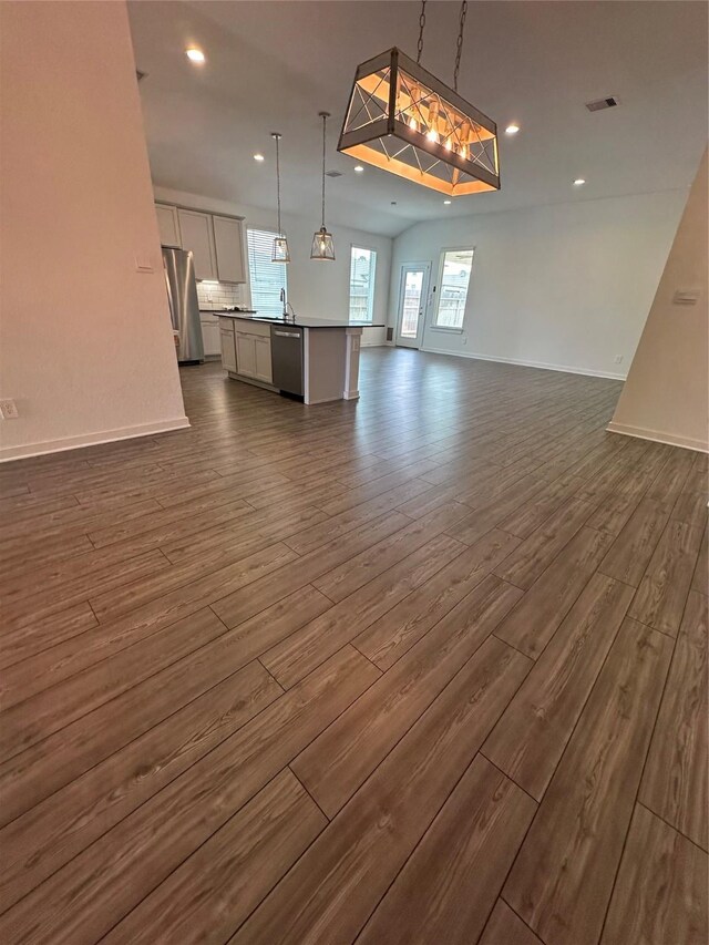 14007 Valley Creek Ct, Conroe, TX 77384 - unfurnished living room with dark wood-style flooring, recessed lighting, and baseboards