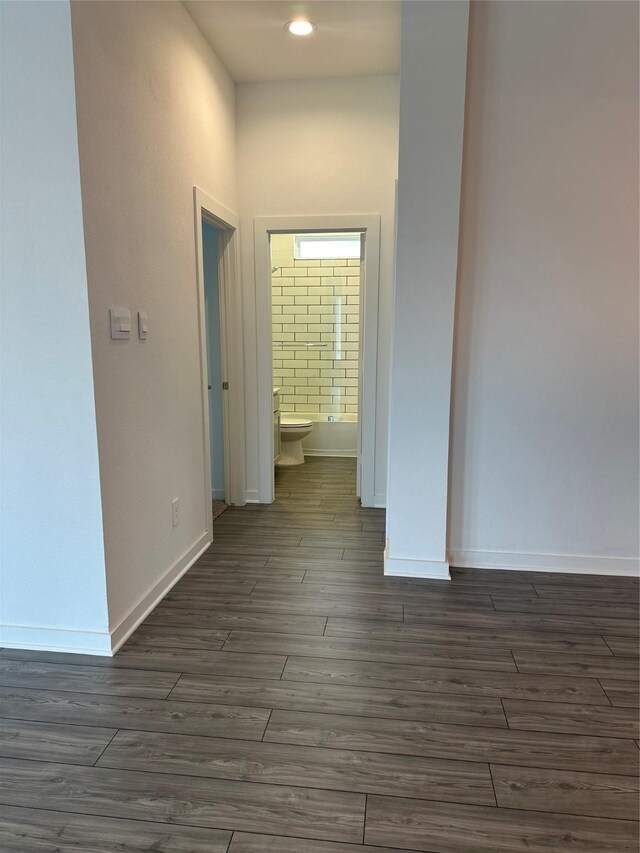 14007 Valley Creek Ct, Conroe, TX 77384 - corridor with dark wood-type flooring, baseboards, and recessed lighting