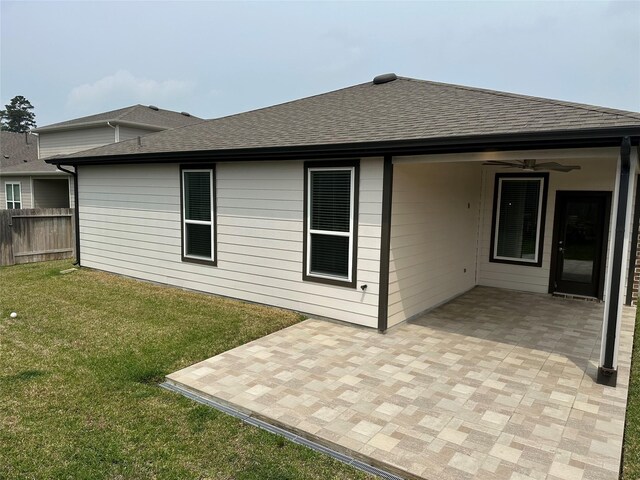 14007 Valley Creek Ct, Conroe, TX 77384 - rear view of property featuring roof with shingles, a patio, and a ceiling fan