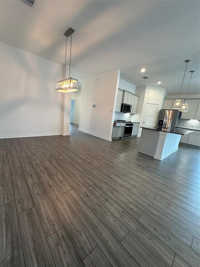 14007 Valley Creek Ct, Conroe, TX 77384 - unfurnished living room with dark wood-style flooring, baseboards, and recessed lighting