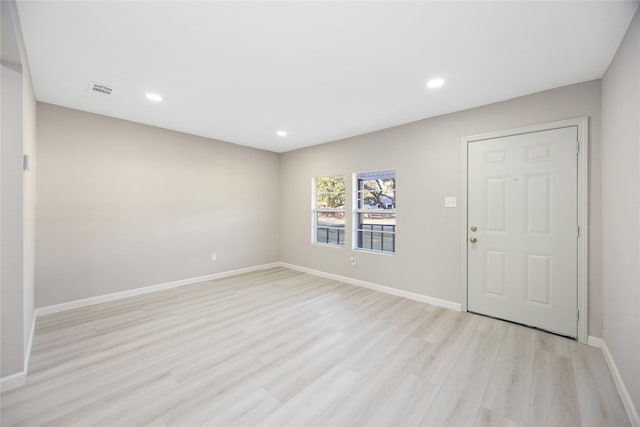 4114 Hoffman St, Houston, TX 77026 - entrance foyer with light wood finished floors, baseboards, and recessed lighting