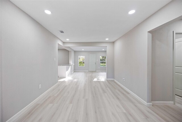 4114 Hoffman St, Houston, TX 77026 - unfurnished living room featuring recessed lighting, light wood-style flooring, and baseboards