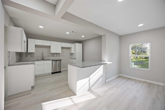 4114 Hoffman St, Houston, TX 77026 - kitchen with dishwasher, a sink, light stone counters, white cabinets, and recessed lighting