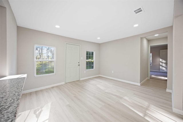 4114 Hoffman St, Houston, TX 77026 - entrance foyer with healthy amount of natural light, light wood-style floors, baseboards, and recessed lighting