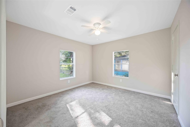 4114 Hoffman St, Houston, TX 77026 - carpeted empty room with healthy amount of natural light, a ceiling fan, and baseboards