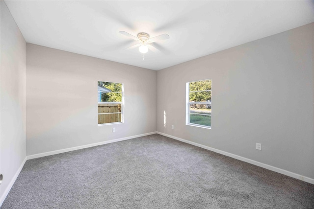 4114 Hoffman St, Houston, TX 77026 - carpeted empty room with plenty of natural light, ceiling fan, and baseboards