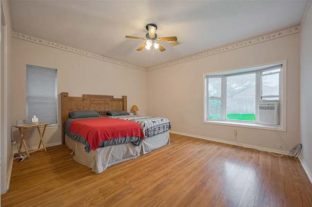 20011 Doherty Cir, Katy, TX 77449 - bedroom featuring light wood-type flooring, baseboards, and ceiling fan