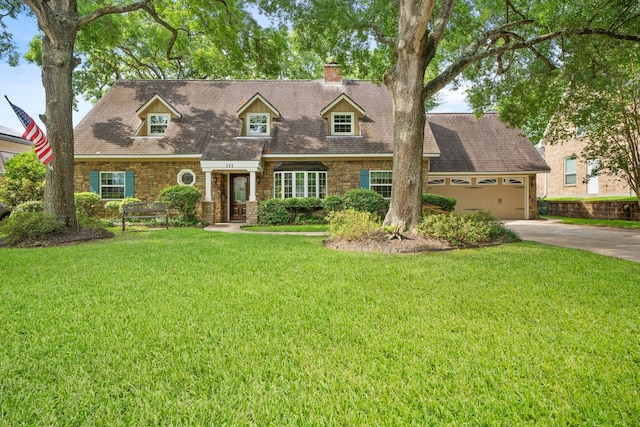 111 Whispering Oaks Dr, Seabrook, TX 77586 - view of front of home with a chimney, driveway, stone siding, a front yard, and an attached garage