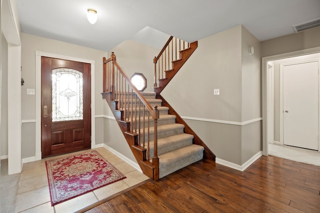 111 Whispering Oaks Dr, Seabrook, TX 77586 - foyer featuring stairway, baseboards, and wood finished floors