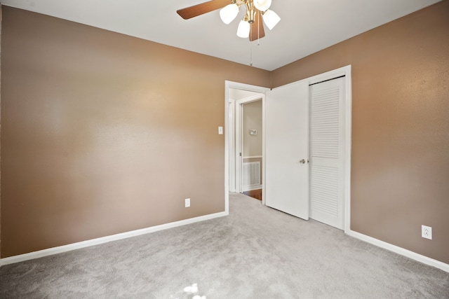 111 Whispering Oaks Dr, Seabrook, TX 77586 - unfurnished bedroom featuring carpet flooring, baseboards, a closet, and ceiling fan