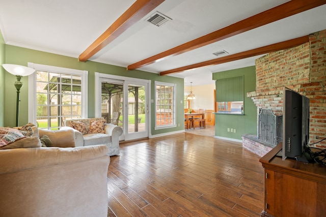 111 Whispering Oaks Dr, Seabrook, TX 77586 - living room featuring beam ceiling, wood finished floors, a chandelier, and baseboards